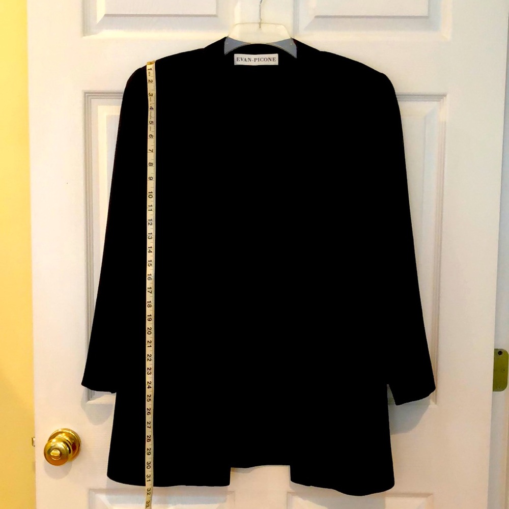 Tuxedo jacket worsted wool jacket with silk  lapel and shoulder pads and lined.
